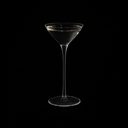 Single two-sip martini glass with clear cocktail on black background