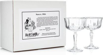 Newport "Social Season" Crystal Cocktail Coupe Glass, Vintage-Inspired 2-Piece Set in Gift Box – HISTORY COMPANY. Elegant coupe glasses with a timeless design, perfect for classic cocktails and refined entertaining. Crafted from fine crystal, these glasses evoke the sophistication of Newport's storied social scene.