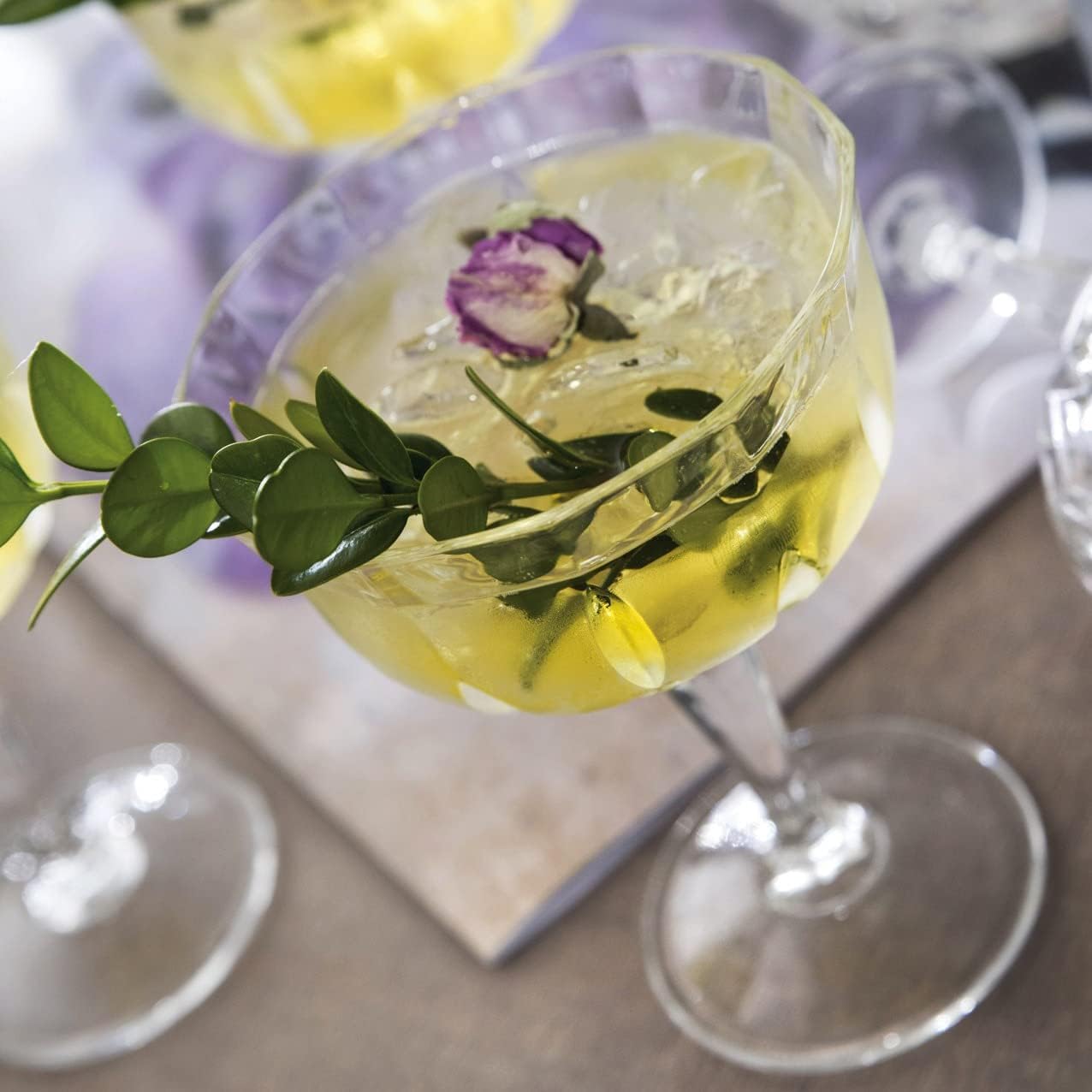 Newport "Social Season" Crystal Cocktail Coupe Glass, Vintage-Inspired 2-Piece Set in Gift Box – HISTORY COMPANY. Elegant coupe glasses with a timeless design, perfect for classic cocktails and refined entertaining. Crafted from fine crystal, these glasses evoke the sophistication of Newport's storied social scene.