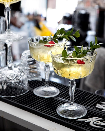 Newport "Social Season" Crystal Cocktail Coupe Glass, Vintage-Inspired 2-Piece Set in Gift Box – HISTORY COMPANY. Elegant coupe glasses with a timeless design, perfect for classic cocktails and refined entertaining. Crafted from fine crystal, these glasses evoke the sophistication of Newport's storied social scene.
